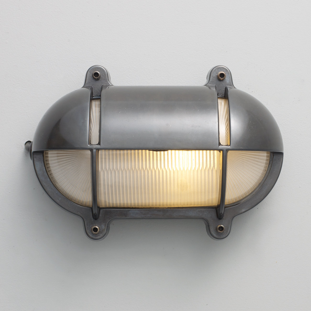 Oval Brass Bulkhead Light with Eyelid Shield 7436 by Davey Lighting